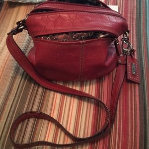 Leather Tignanello reddish orange in color-